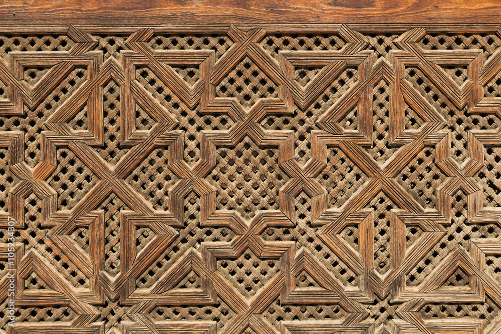 carved wood decoration on a wall in Fes