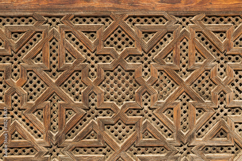 carved wood decoration on a wall in Fes