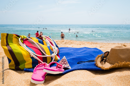 Women's accessories on the sandy beach