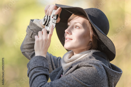 Happy female photographer w...