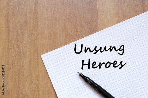 Unsung heroes write on notebook