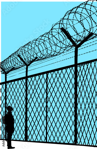 man in front of the fence 