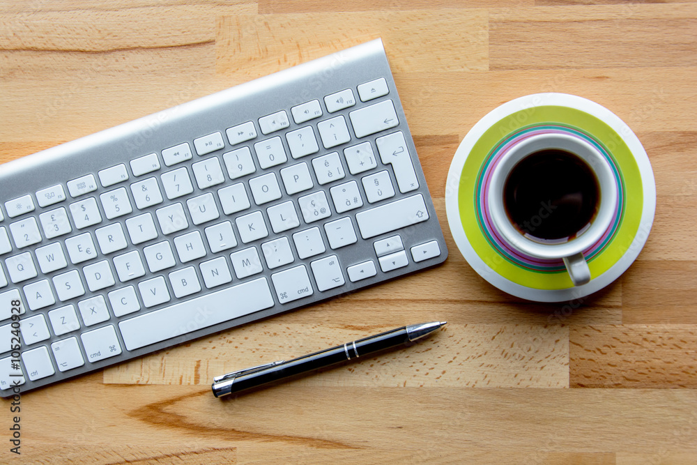 Office desk with keyboard, coffee and pen Office desk with keyboard, coffee and pen