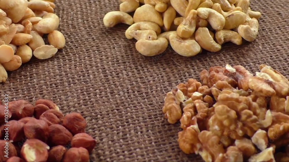 Almonds, cashew, walnuts and hazelnuts lying on burlap
Almonds, cashew, walnuts and hazelnuts lying on burlap