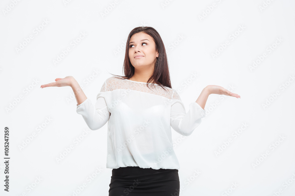 Thoughtful businesswoman holding hands like a libra