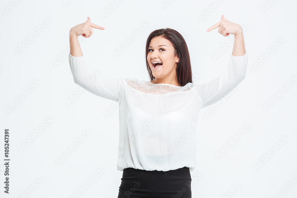 Cheerful businesswoman pointing finger at herself Cheerful businesswoman pointing finger at herself