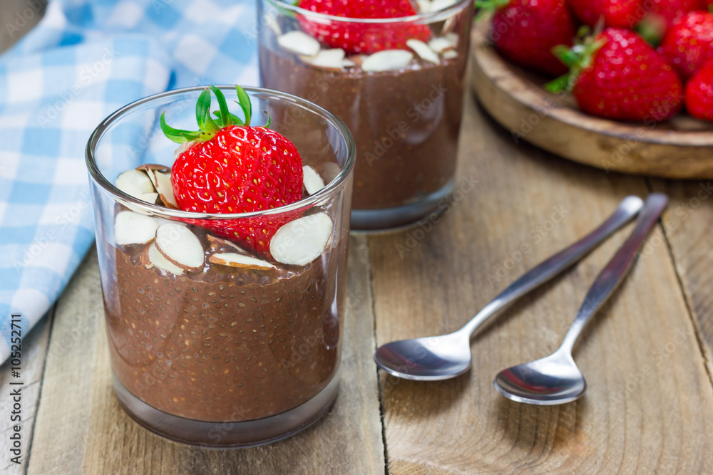 Chocolate chia seed pudding garnished with almond slices and strawberry Chocolate chia seed pudding garnished with almond slices and strawberry
