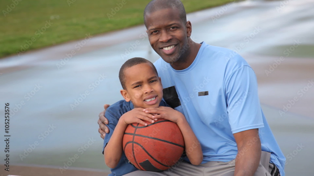 Portrait of father and son with basketball Portrait of father and son with basketball