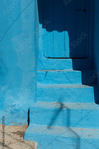 blue door with stairs in the blue town of Chefchaouen photo