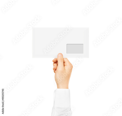White blank envelope mock up holding in hand. Empty post document.