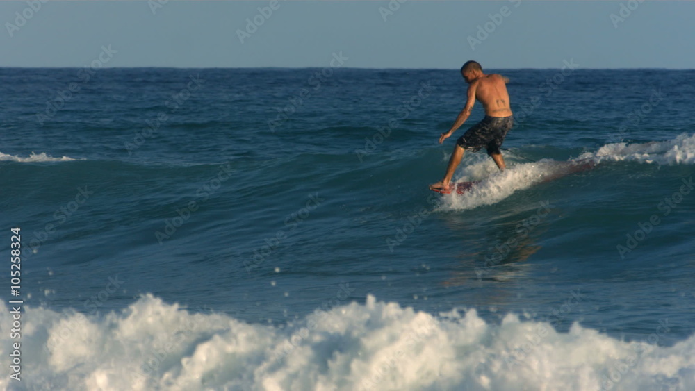 Long board surfer hangs ten, slow motion Long board surfer hangs ten, slow motion