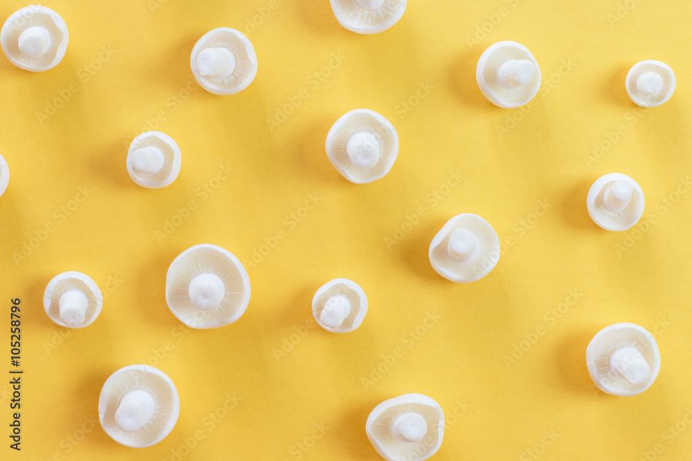 White Shimeji mushroom on yellow background flat lay