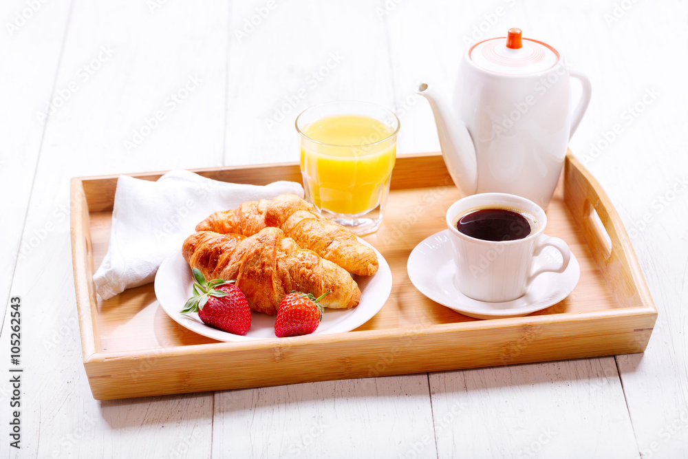 Breakfast with cup of coffee and croissants Breakfast with cup of coffee and croissants