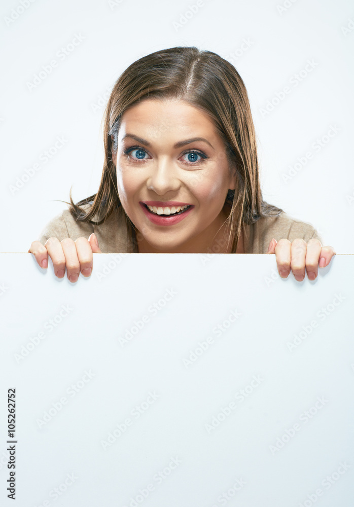 Woman looks out from behind white blank sign board. Woman looks out from behind white blank sign board.