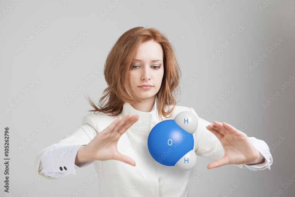 Young woman scientist with model of water molecule. Young woman scientist with model of water molecule.