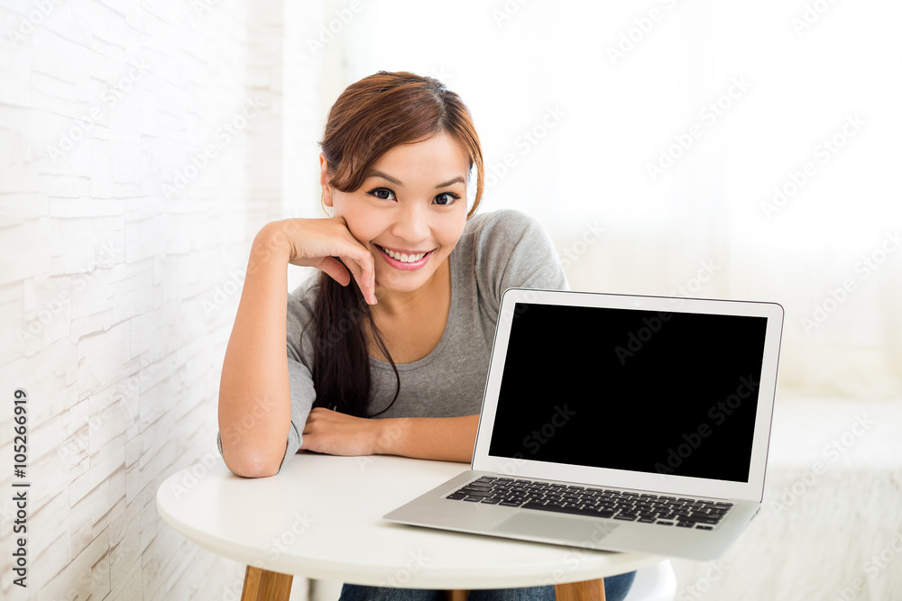 Asian woman with blank screen of laptop computer Asian woman with blank screen of laptop computer
