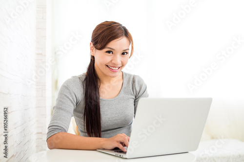 Woman use of laptop computer © leungchopan