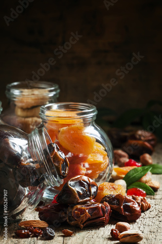 Dried dates in a glass jar, selective focus