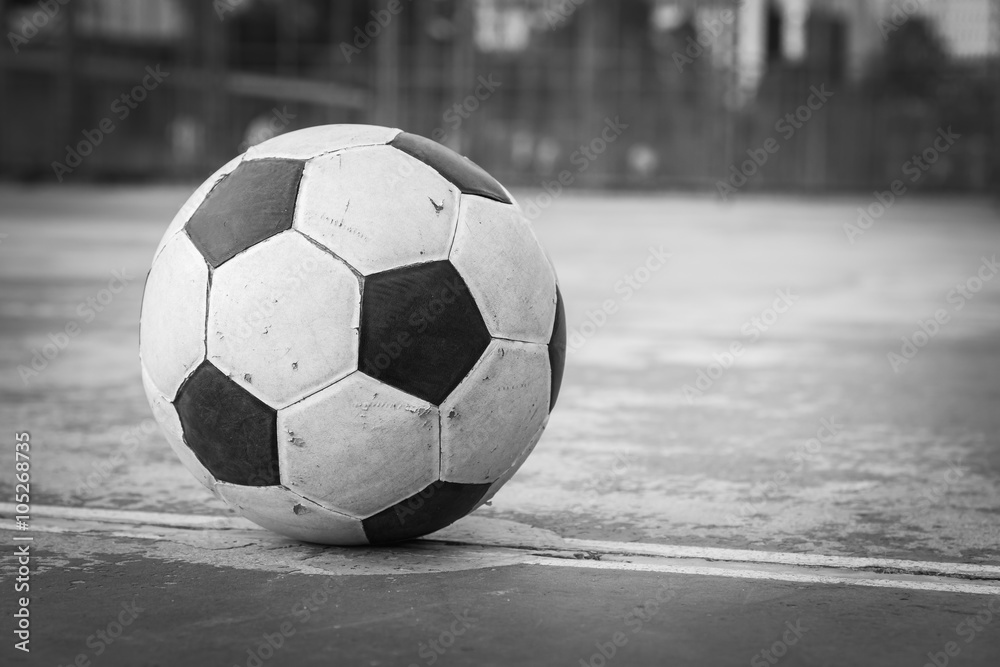 black and white old ball at kick off point 