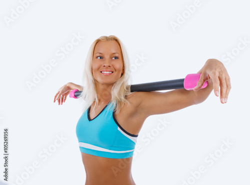 Athletic blond woman doing exercises. © Fxquadro