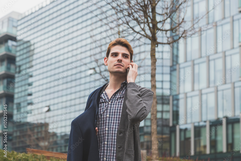 Young man talking on phone Young man talking on phone