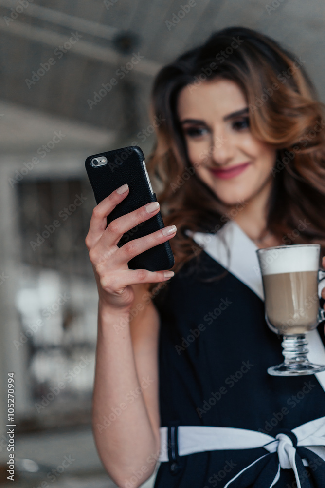 Style lady sitting at the table in cafe and smiling Style lady sitting at the table in cafe and smiling