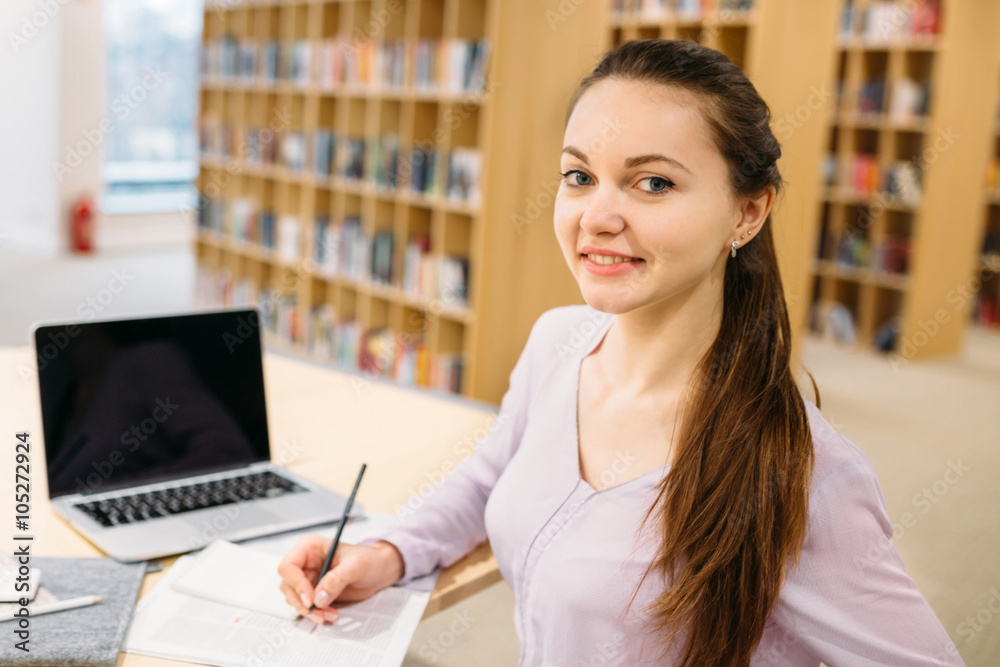 Student girl studying at library Student girl studying at library