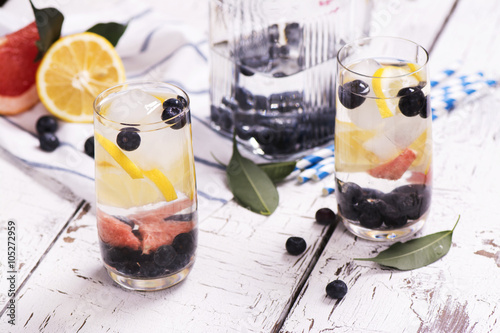 Refreshing homemade summer cocktail with berries and fruits. Selective focus