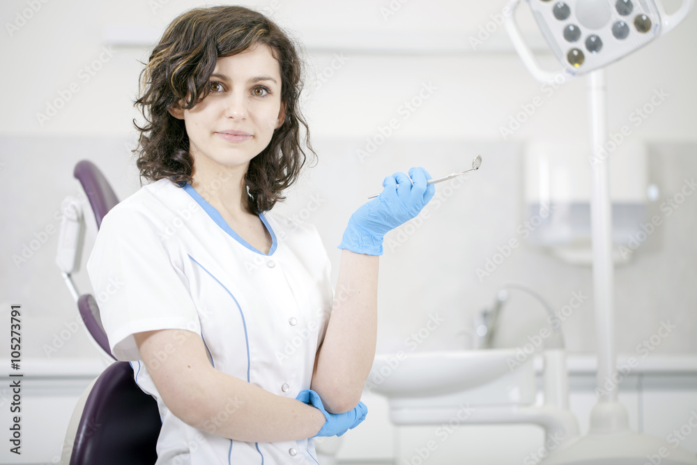Young professional woman dentist in the dental office Young professional woman dentist in the dental office