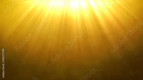 Holy light shining from above on a golden background with dust particles floating around.