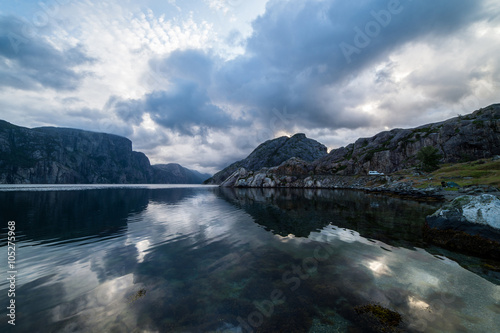 Nature summer landscape in Norway with mountains, fjord and clou