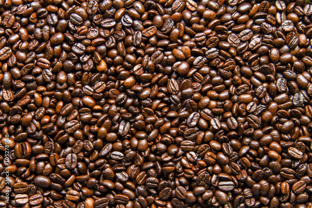 Roasted coffee beans background texture. Roasted coffee beans background texture.
