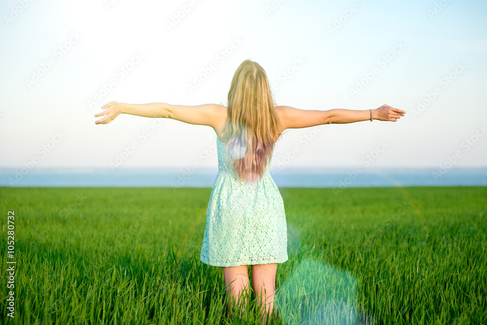 Happiness woman stay outdoor under sunlight of sunset Happiness woman stay outdoor under sunlight of sunset