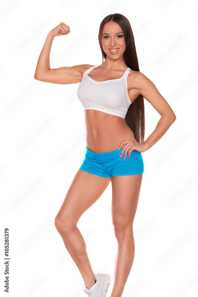Fitness woman in sport style standing against isolated white background Fitness woman in sport style standing against isolated white background