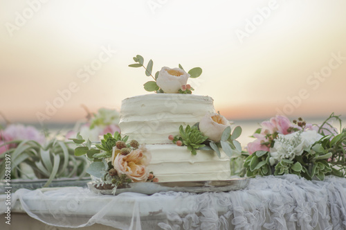 Delicate wedding cake with pink peonies