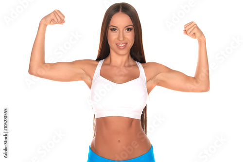 Fitness woman in sport style standing against isolated white background