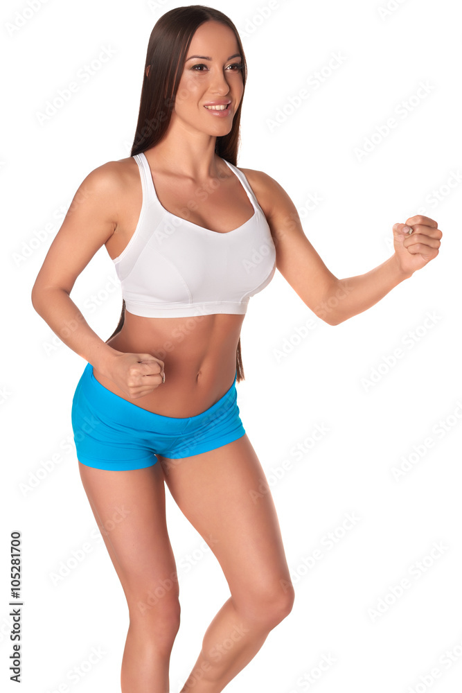 Fitness woman in sport style standing against isolated white background Fitness woman in sport style standing against isolated white background
