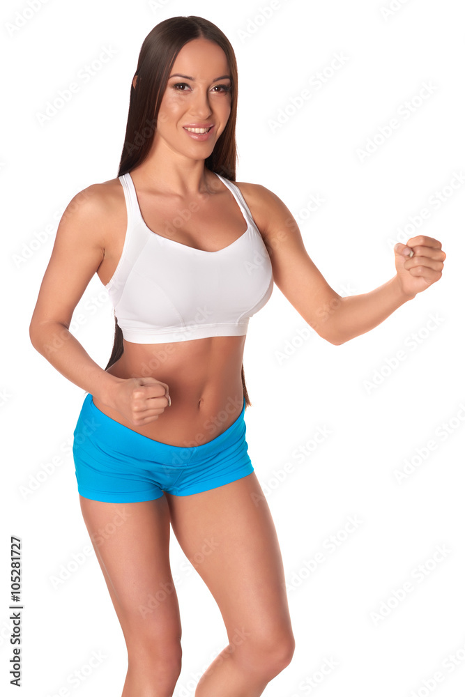 Fitness woman in sport style standing against isolated white background Fitness woman in sport style standing against isolated white background
