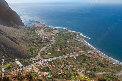 Above the headland of the Valle Gran Rey on the Canary Island La Gomera. View to the villages at the end of the canyon. Vueltas, La Puntilla, Borbalan. Also the harbor, situated in the village Vueltas photo