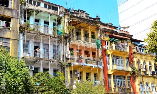 Yangon, Myanmar - March 9, 2015: A street archtecture view with colonial building in the town of Yangon