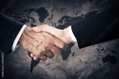 Successful business people handshaking closing a deal  photo