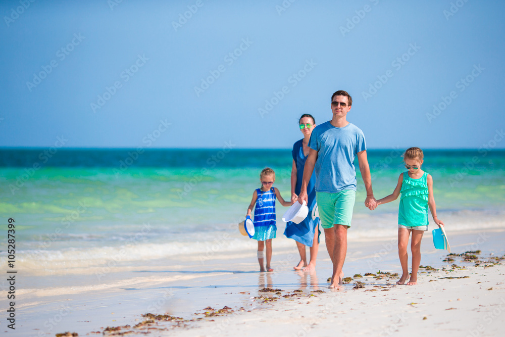 Happy young family beach vacation
