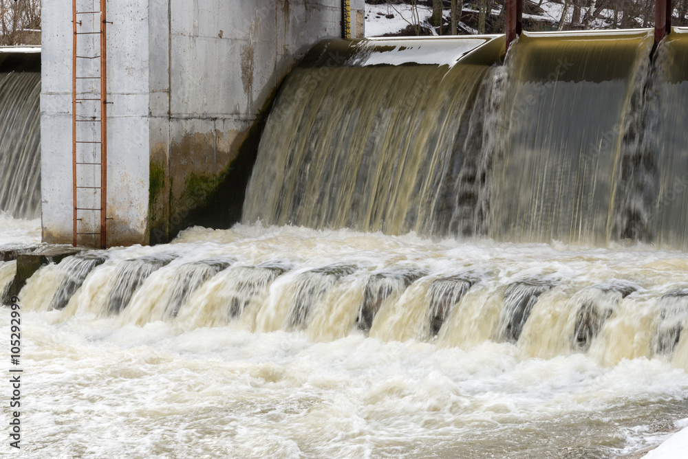 Fotografie Spring flood on the river dam. High water