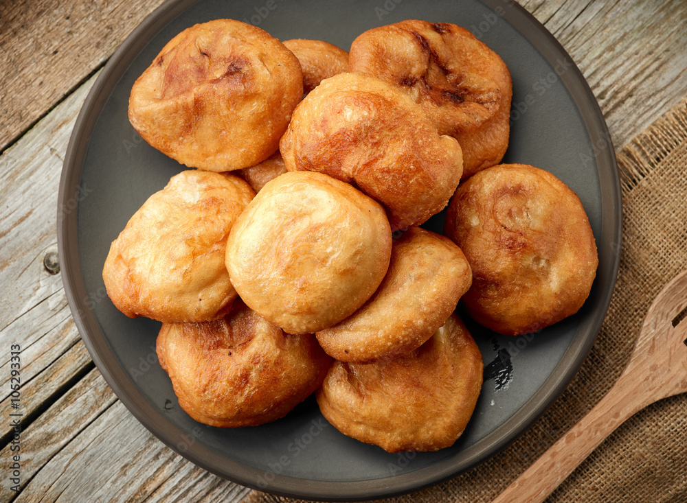 fried meat pies on dark plate fried meat pies on dark plate