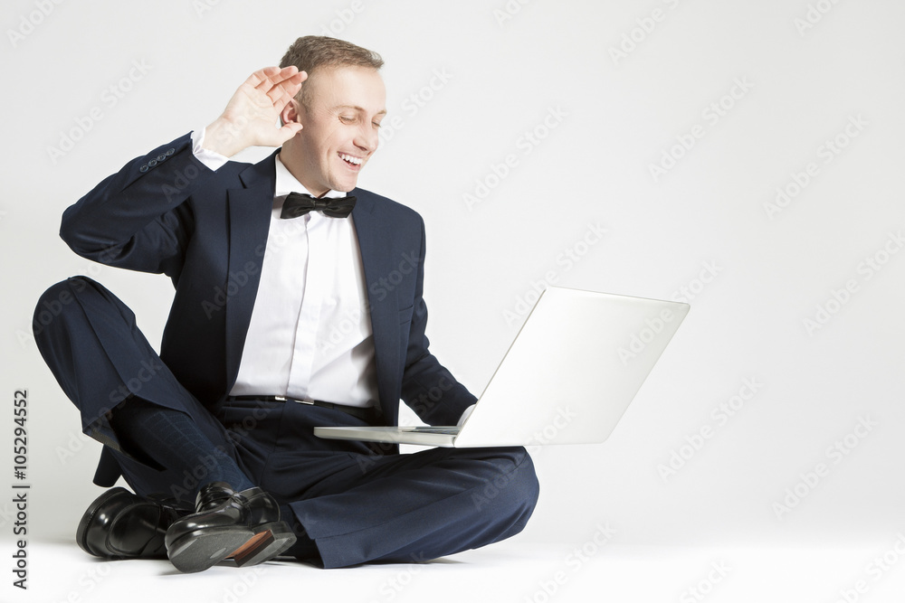 Happy Smiling Caucasian Man in Blue Suit with Laptop Chatting and Chatting Happy Smiling Caucasian Man in Blue Suit with Laptop Chatting and Chatting