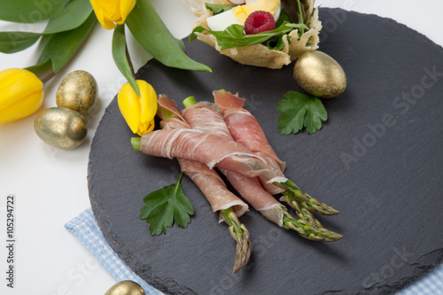 Fototapeta Naklejka Na Ścianę i Meble -  Grilled asparagus wrapped in prosciutto.