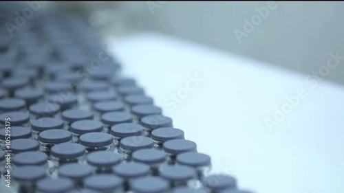 Detail of automated line for marshalling bottles of medicines. photo