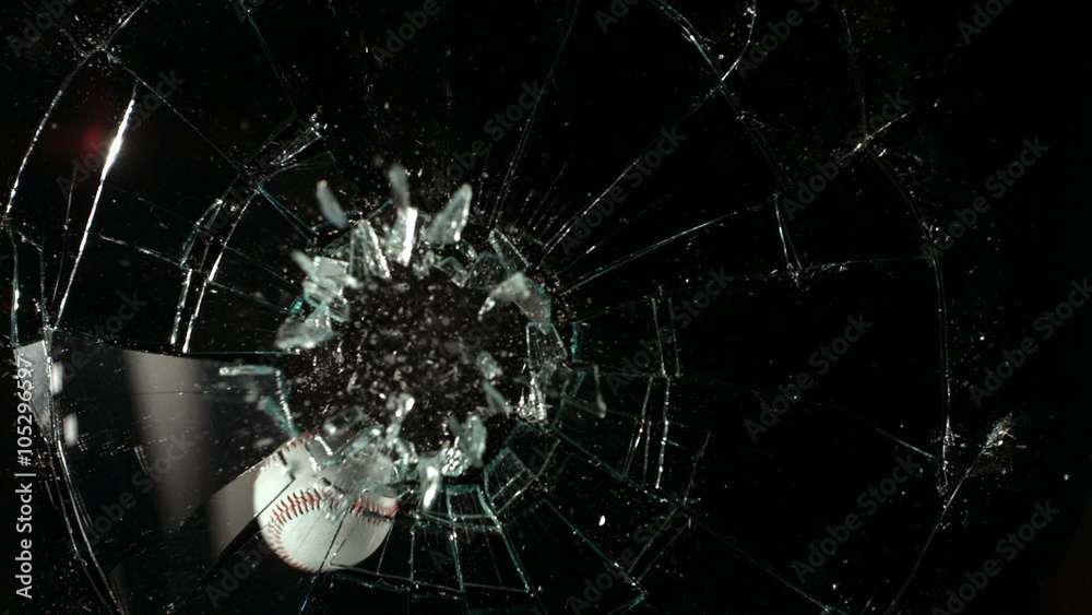 Baseball hitting glass window, slow motion