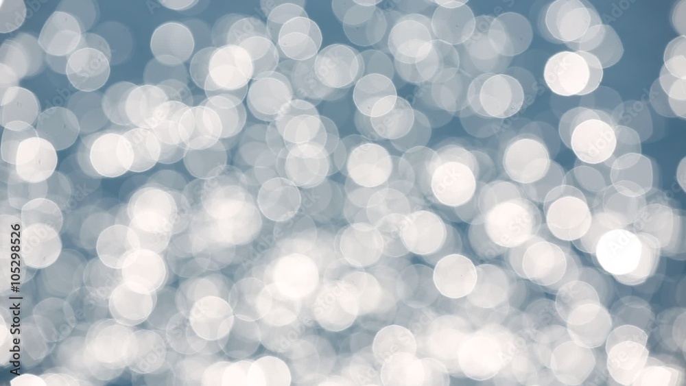 Bokeh background of blue sea water with sun reflections Bokeh background of blue sea water with sun reflections