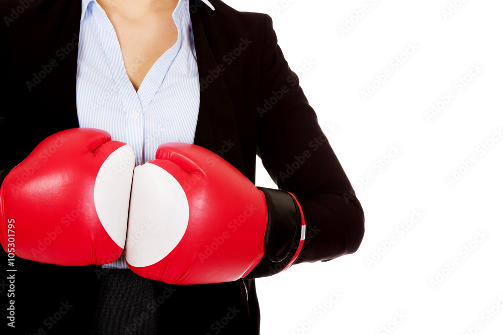 Business woman in red boxing gloves